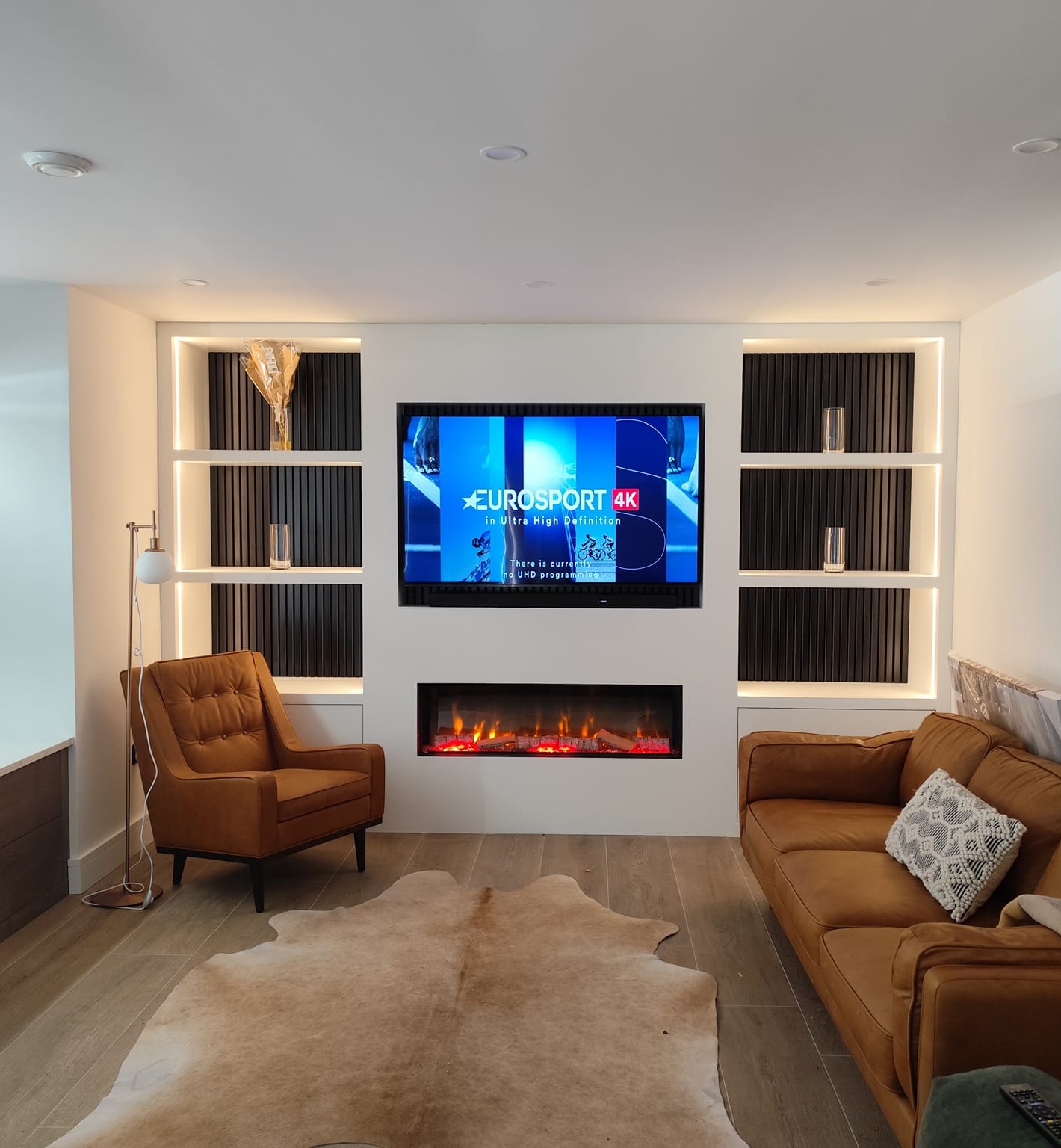 Modern media wall with integrated lighting and fireplace